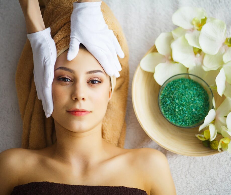 beauty-care-cosmetologist-makes-face-massage-min
